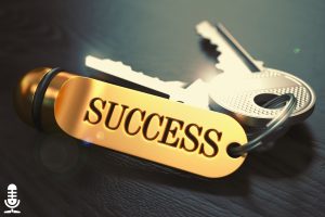 Keys on a keychain with a fob that reads SUCCESS